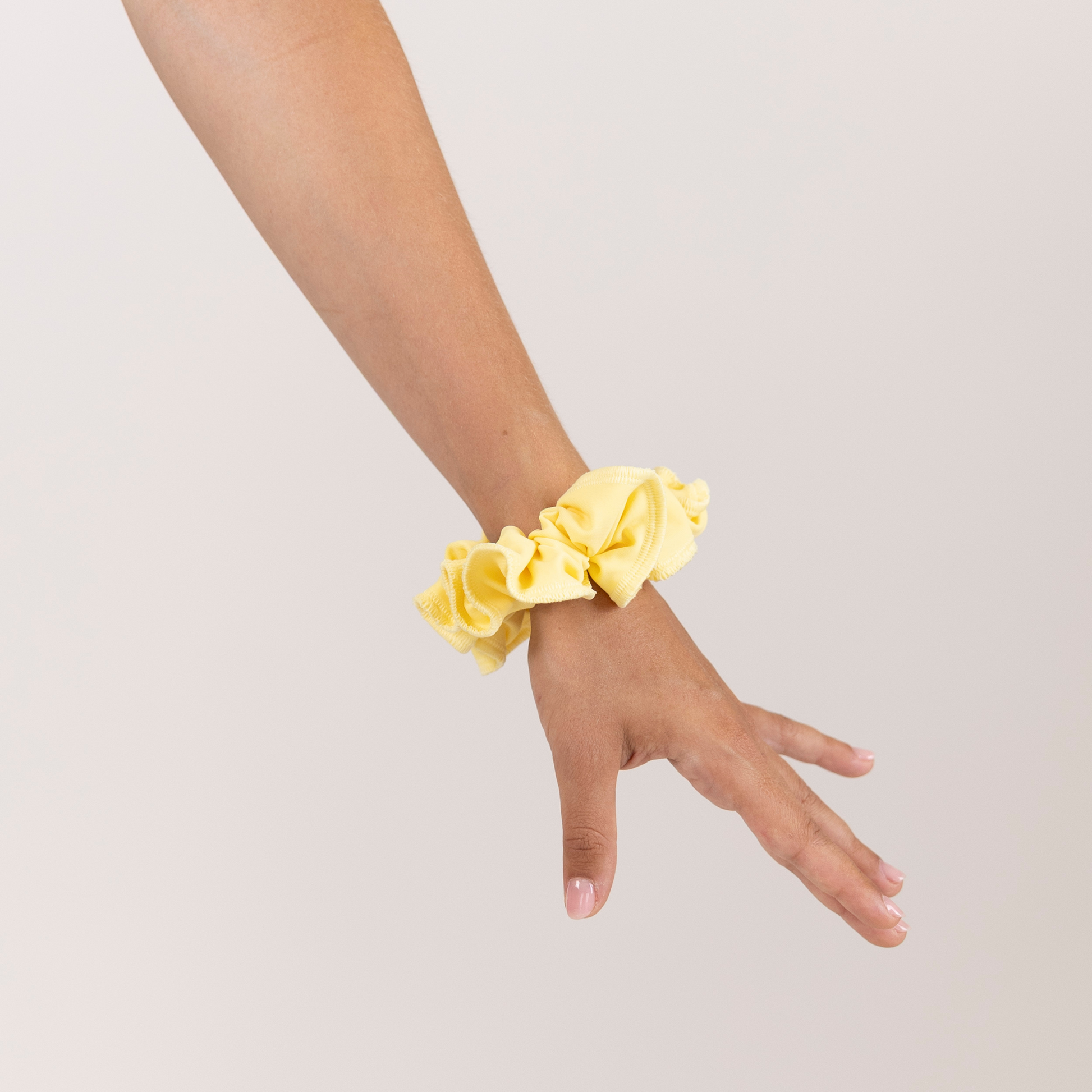 Girl with Butter Yellow on wrist.