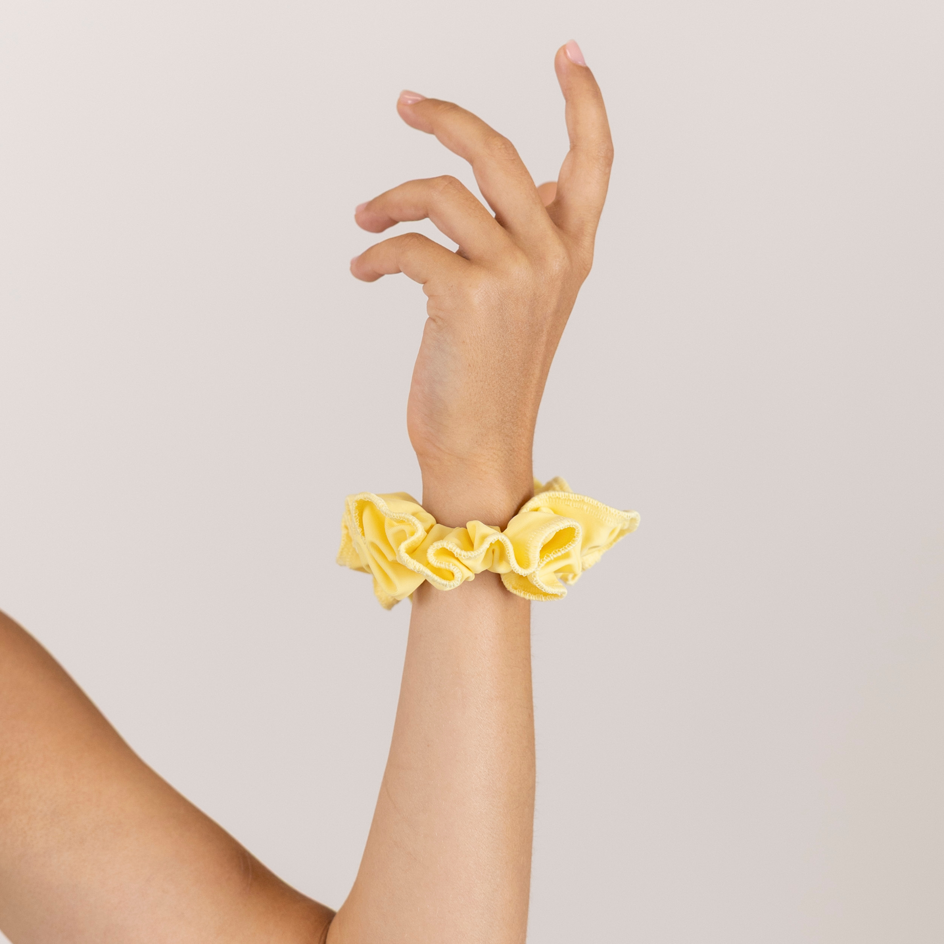 Girl with Butter Yellow on wrist.