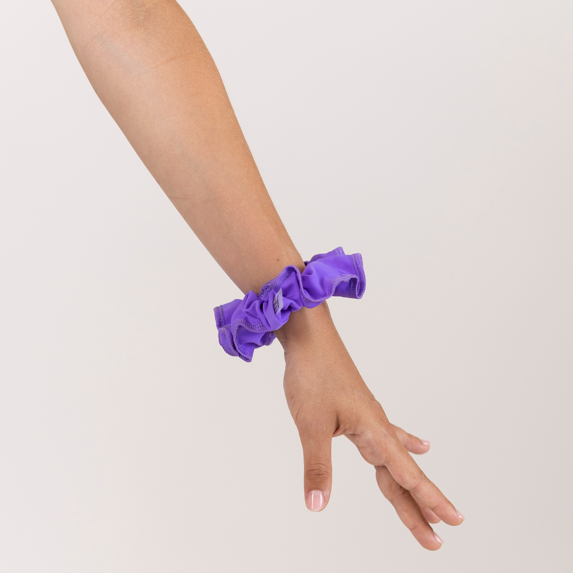 Girl with Purple Scrunchie on wrist.