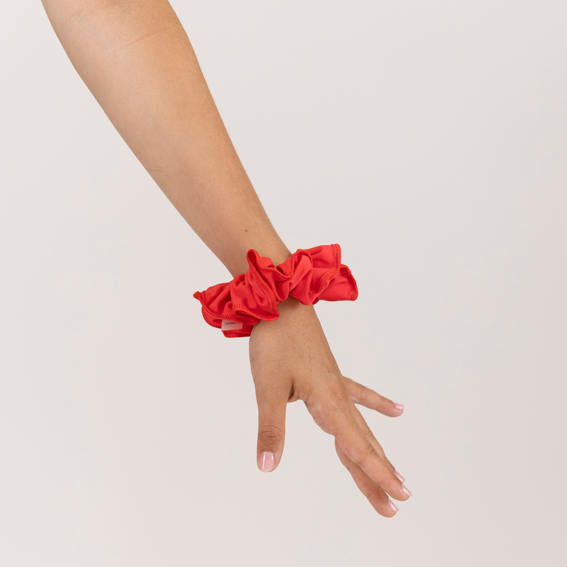 Girl with Red Scrunchie on wrist.