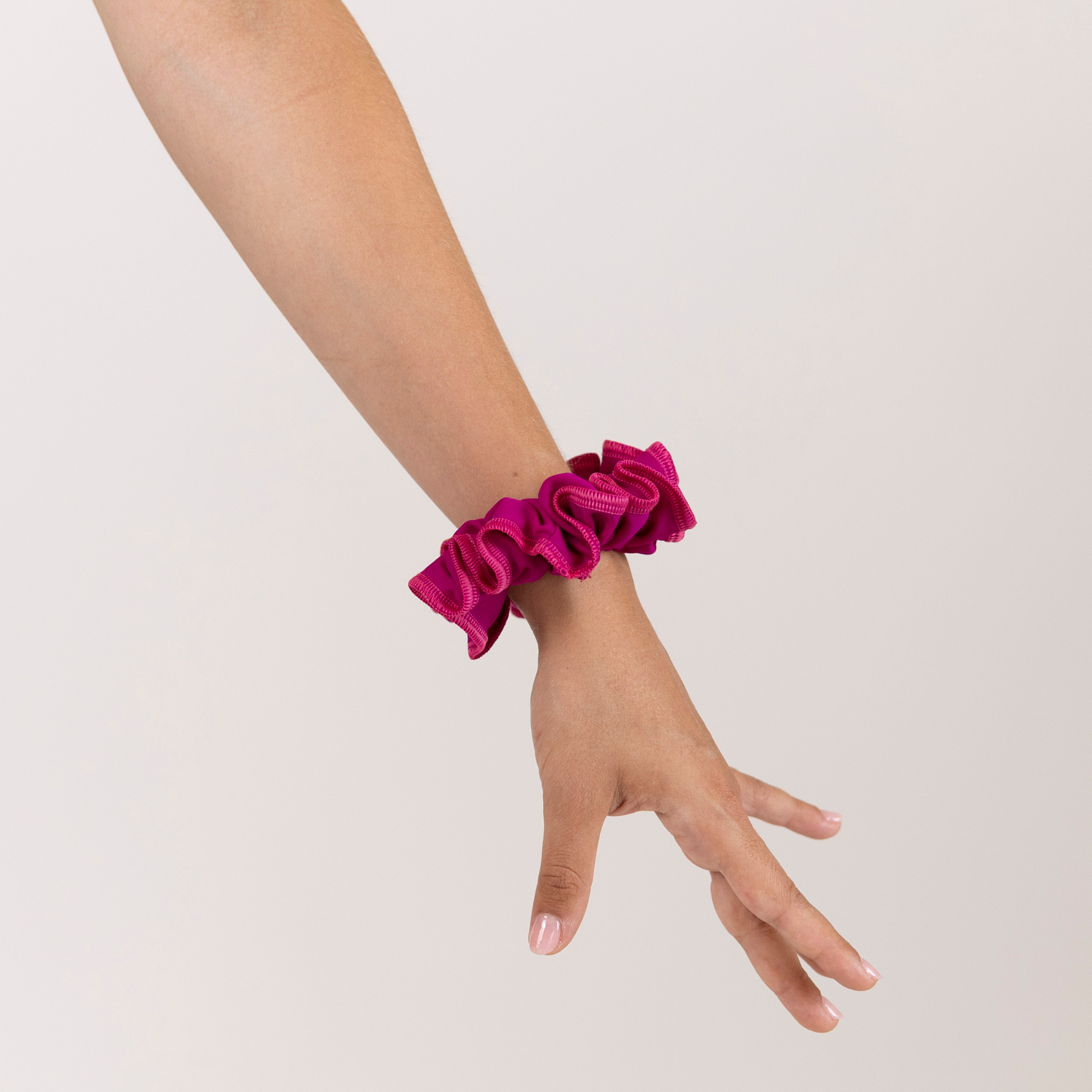 Girl with Rubi Scrunchie on wrist.